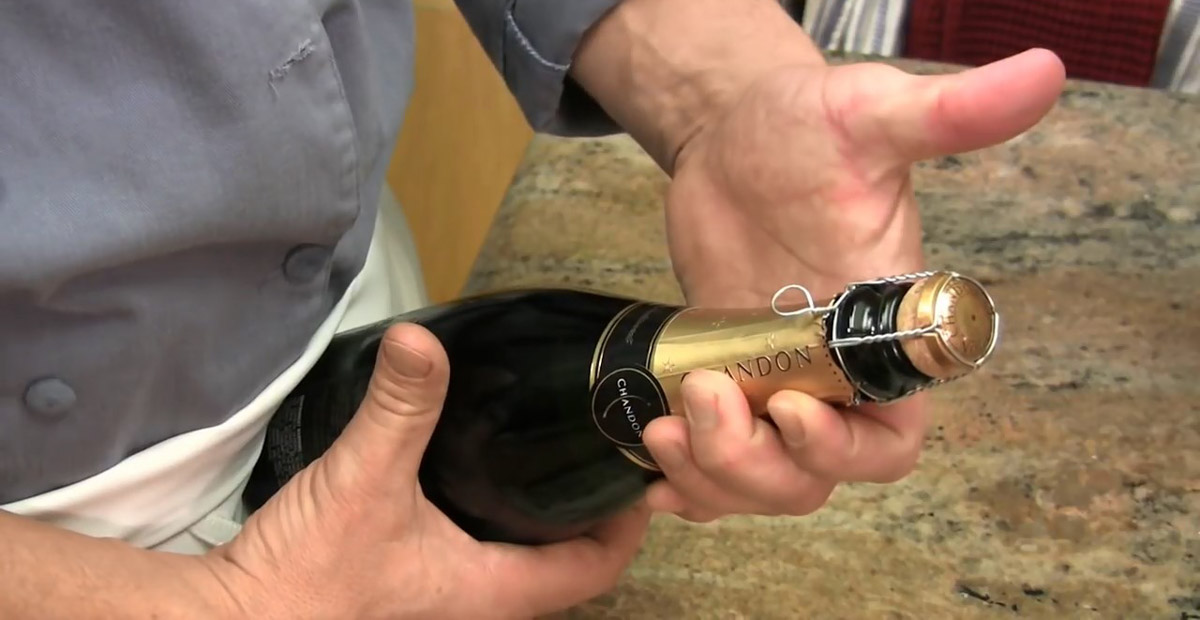 3. Hold you wine with cork in your palm