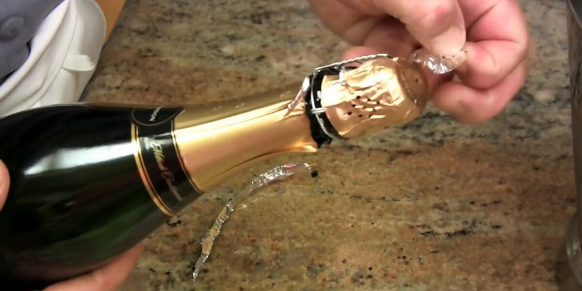 Take off a foil bottle seal