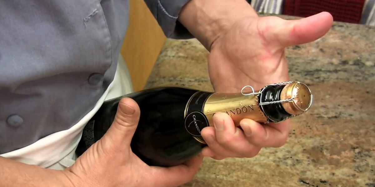 Hold your wine with cork in your palm